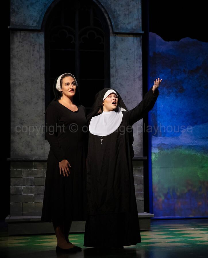Casey Maxwell as Maria, and Cadence Collins as Mother Abbess